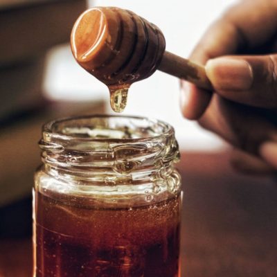 Honey jar with honey dipper.